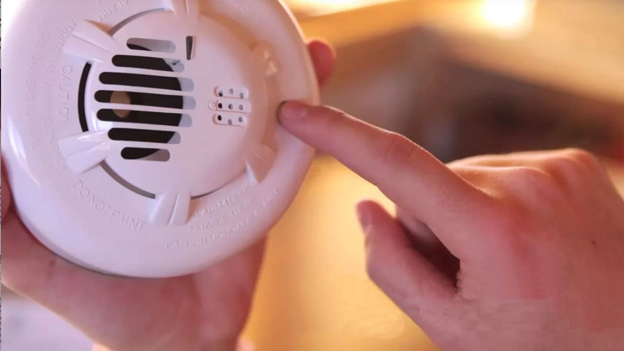 Carbon monoxide detector mounted on a wall inside a home
